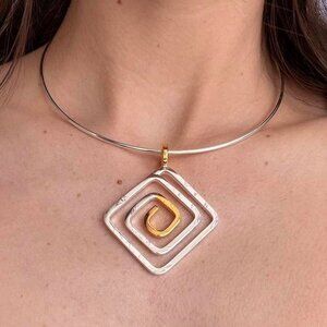 Silver and gold tone choker necklace with square swirl pendant